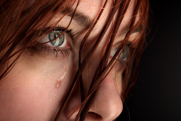 beauty girl cry on black background