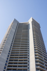 Fototapeta na wymiar Condo Tower with Balconies from Ground