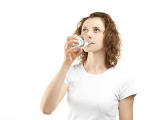 Young woman drinking clear water