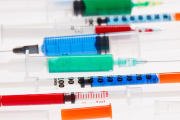 Many multicolor syringes, medical concept still life