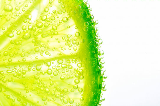Lime with bubbles on white