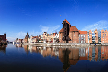 Fototapeta premium The riverside with the characteristic crane of Gdansk, Poland.