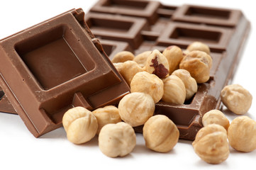chocolate bar with nuts on white background