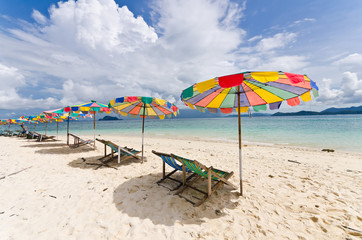 Beach chair and colorful umbrella on the beach in sunny day, Phu