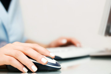 Female hands using computer