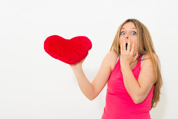 woman holding red valentine heart