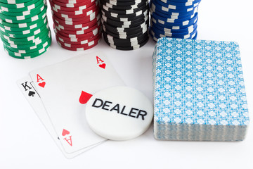 Casino cards chips and dealer over white