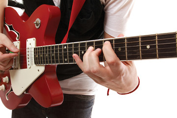 Fototapeta na wymiar Closeup of a guitarist playing, focus on his hands