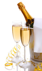 Champagne bottle in bucket with ice and glasses of champagne,