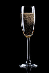 glass of champagne on black background