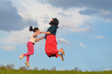 happy young woman mother play and outdoor with beautiful child