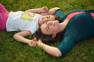 Fototapeta na wymiar happy young woman mother play and outdoor with beautiful child