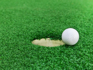 Golf ball near the hole