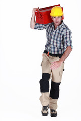 Worker running with a toolbox