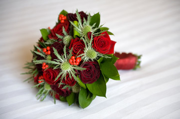 wedding bouquet of roses and eryngium