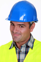 Close-up shot of a smiling tradesman
