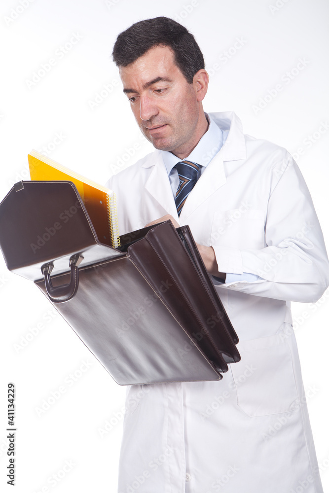 Wall mural man holding a briefcase and tooking some documents from inside