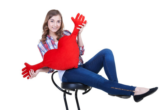 Beautiful girl with A red plush heart