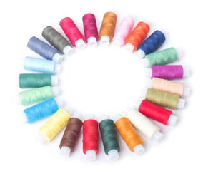 circle of colorful threads on a white