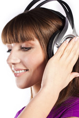 Fototapeta premium Pretty woman listening, and enjoying music