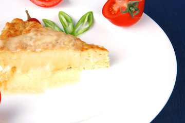 vegetable casserole piece over white plate