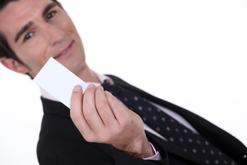 Man holding up a blank card