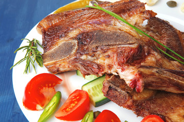 meat steak on white plate with green hot pepper