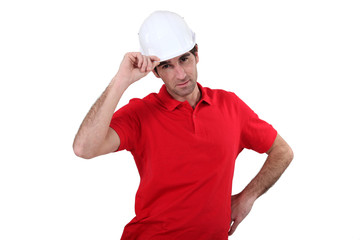 craftsman putting on his helmet