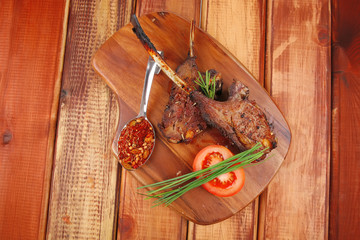 meat savory on wooden plate: roast ribs