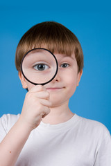 Boy with magnifying glass