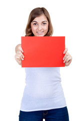 Beautiful girl with a red sheet of paper winks