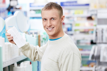 Fototapeta na wymiar A young customer in the pharmacy