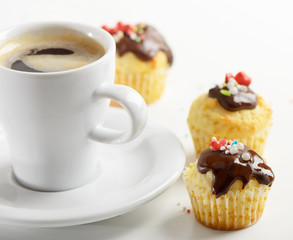 Coffee cup and muffins