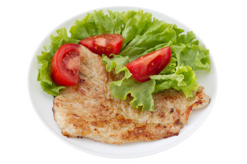 fried turkey with salad on the white plate