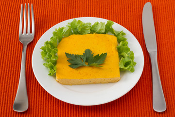 souffle with carrot on the white plate