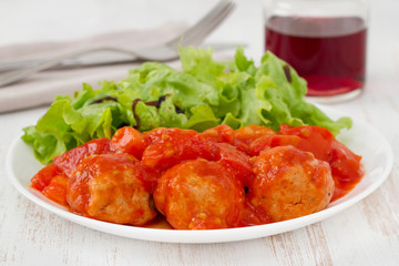 turkey meatballs with tomato paste on the plate