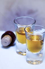 Two shots and cork on table