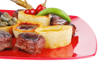 grilled beef meat on red