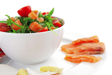 salad with smoked salmon in white bowl