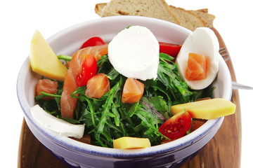 salad with salmon on bread with tomatoes