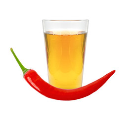 glass of pepper vodka and red chili pepper isolated on white