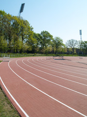 summer athletic stadium with run race tracks and sophit masts