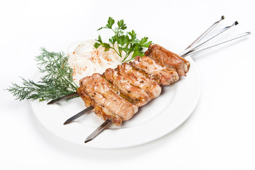 fried kebab with onion on plate with white background