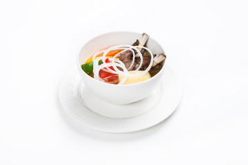 soup with meat and vegetables with white background