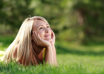 Naklejka premium happy young attractive woman outdoors