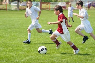 boys kicking ball