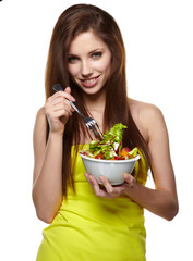 The beautiful cheerful young woman has breakfast salad