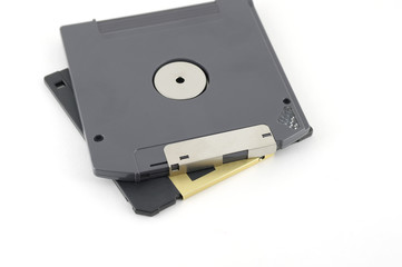 ZIP and floppy disks over white