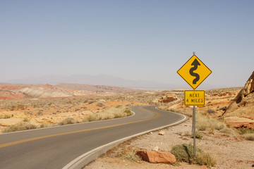 Road Sign for Curves in Desert