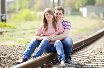 Fototapeta premium Couple sitting at railway.